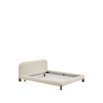 Cama Odina com capa removível em bouclé cru, pés em freixo maciço com acabamento em nogueira FSC, para colchão de 180 x 200 cm.